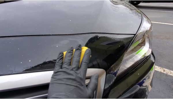 Will acetone remove paint on a car?